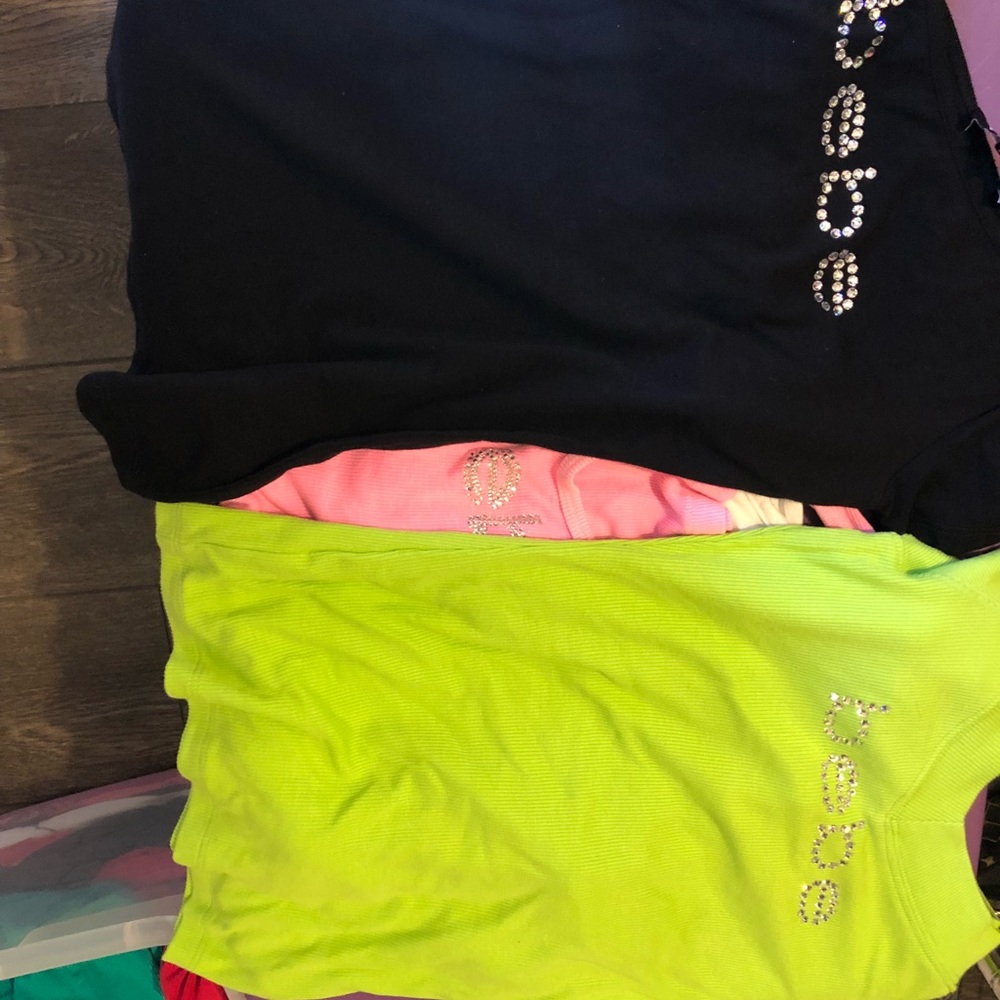 Bebe tops all sizes available Lot 100 pieces